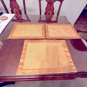 Total 8 gold/yellow placemats. 18x13